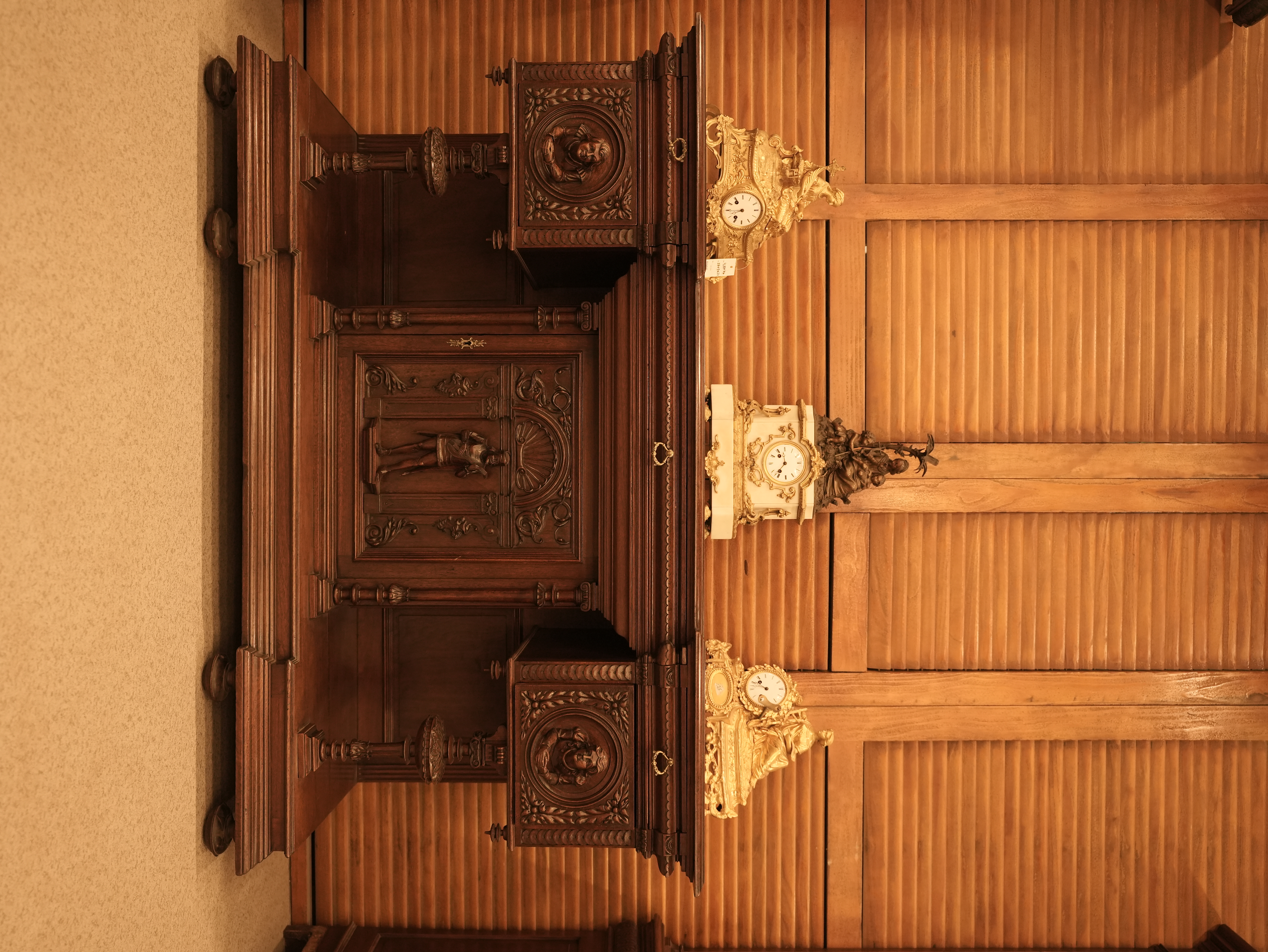 Antique French Renaissance Revival sideboard or buffet a deux corps, likely crafted from richly carved walnut in the late 19th century.