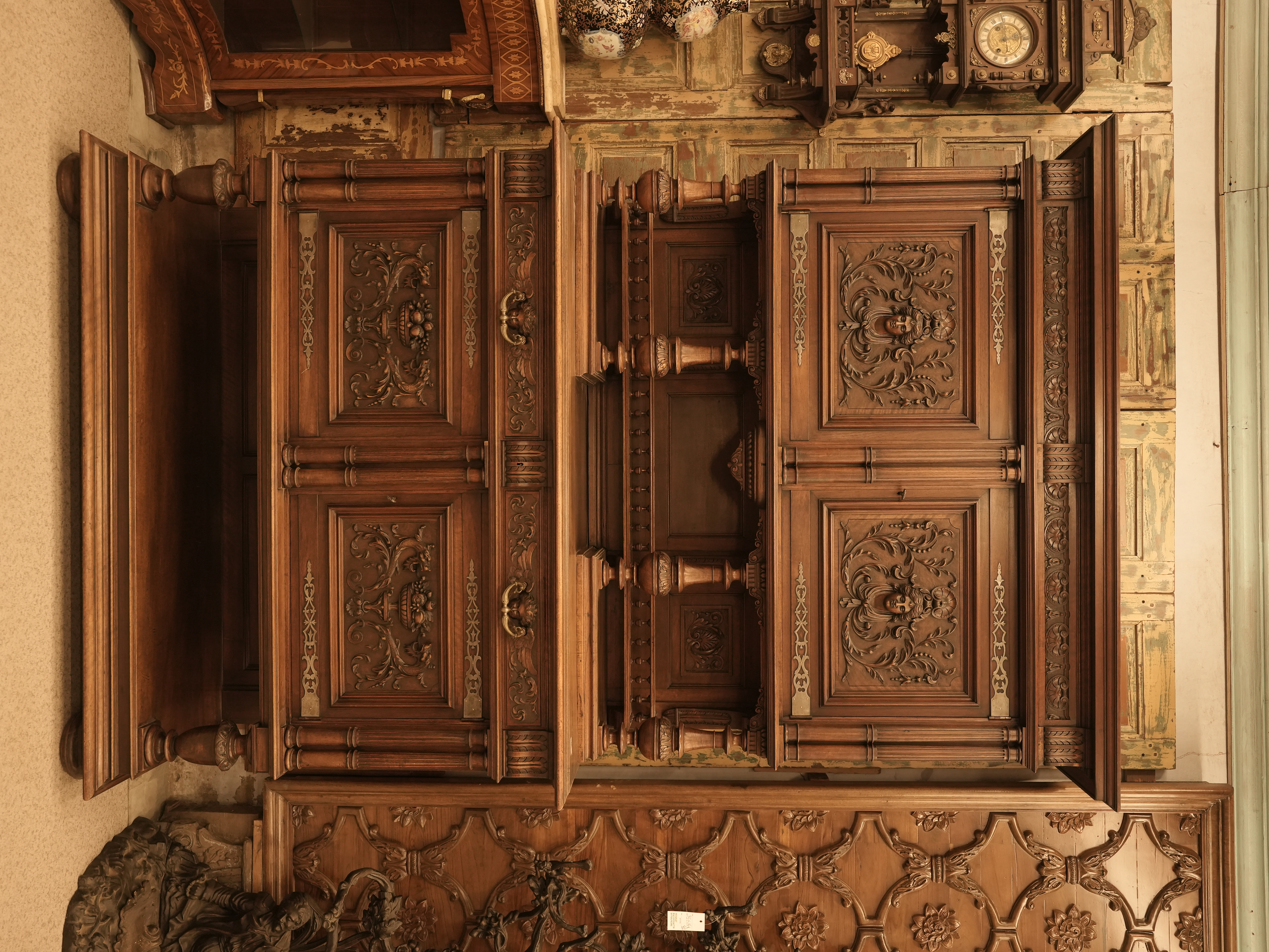Renaissance Revival or Gothic Revival corner cabinet made of carved oak, dating to the late 19th century.