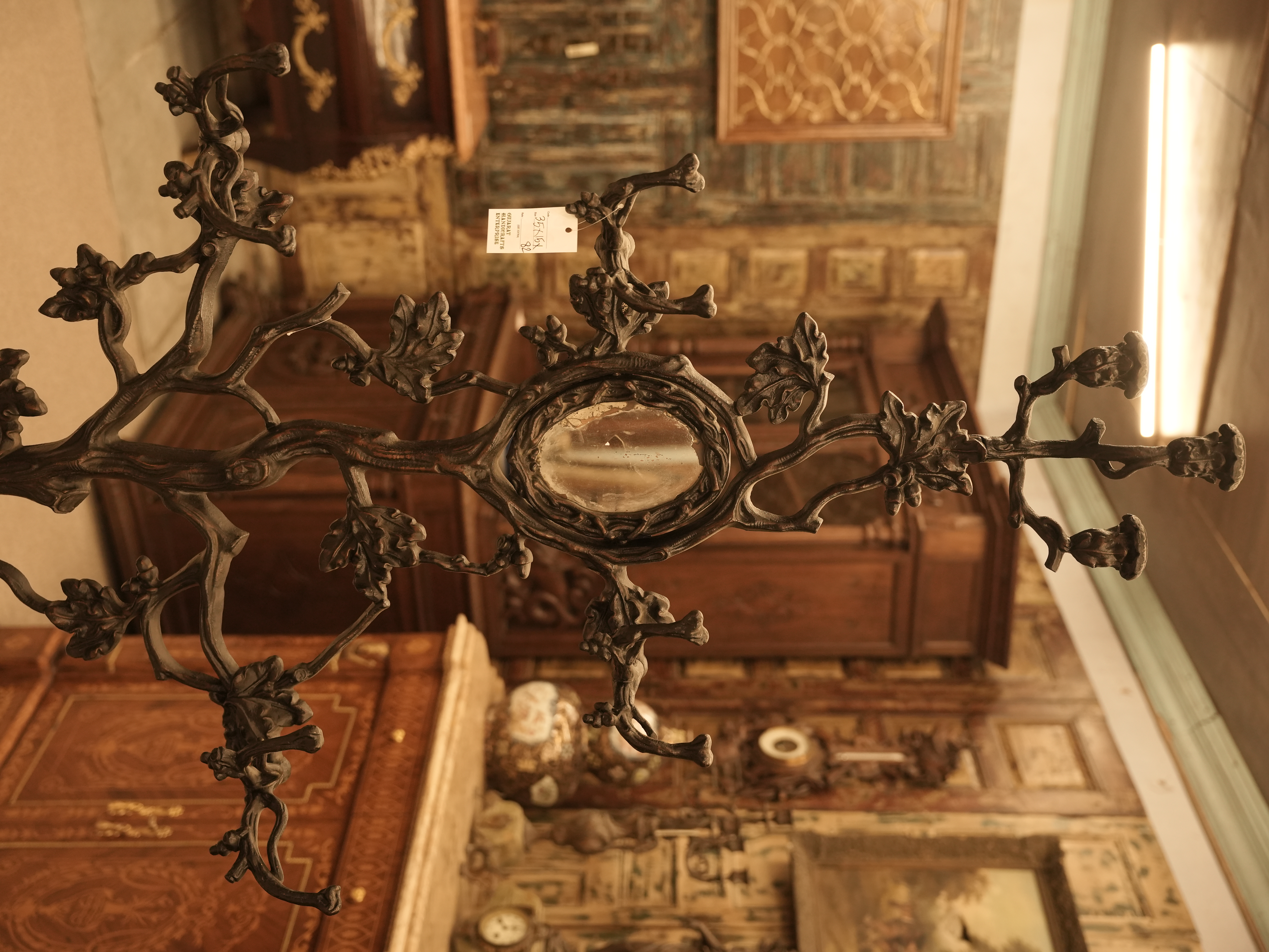 Teakwood geometric floral handcart design used in wall partition and ceiling.