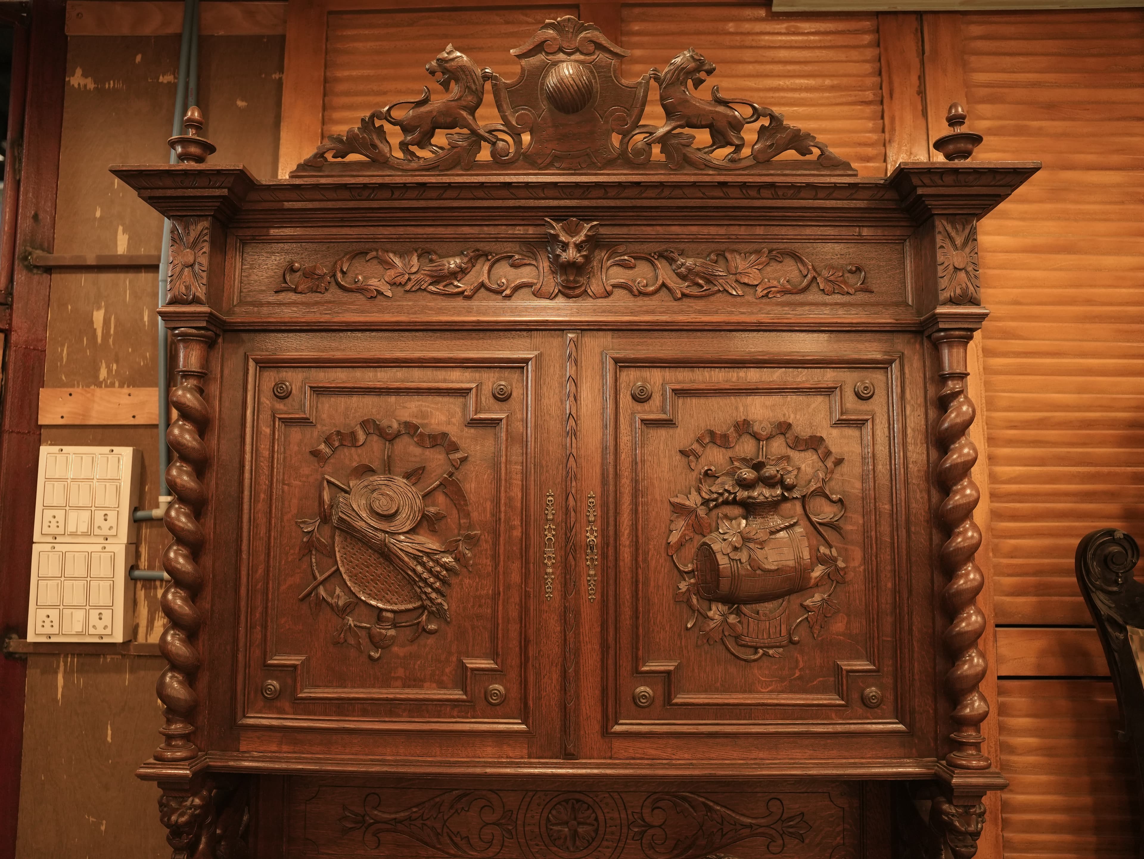 This is a Renaissance Revival or Henri II style carved oak buffet a deux corps.