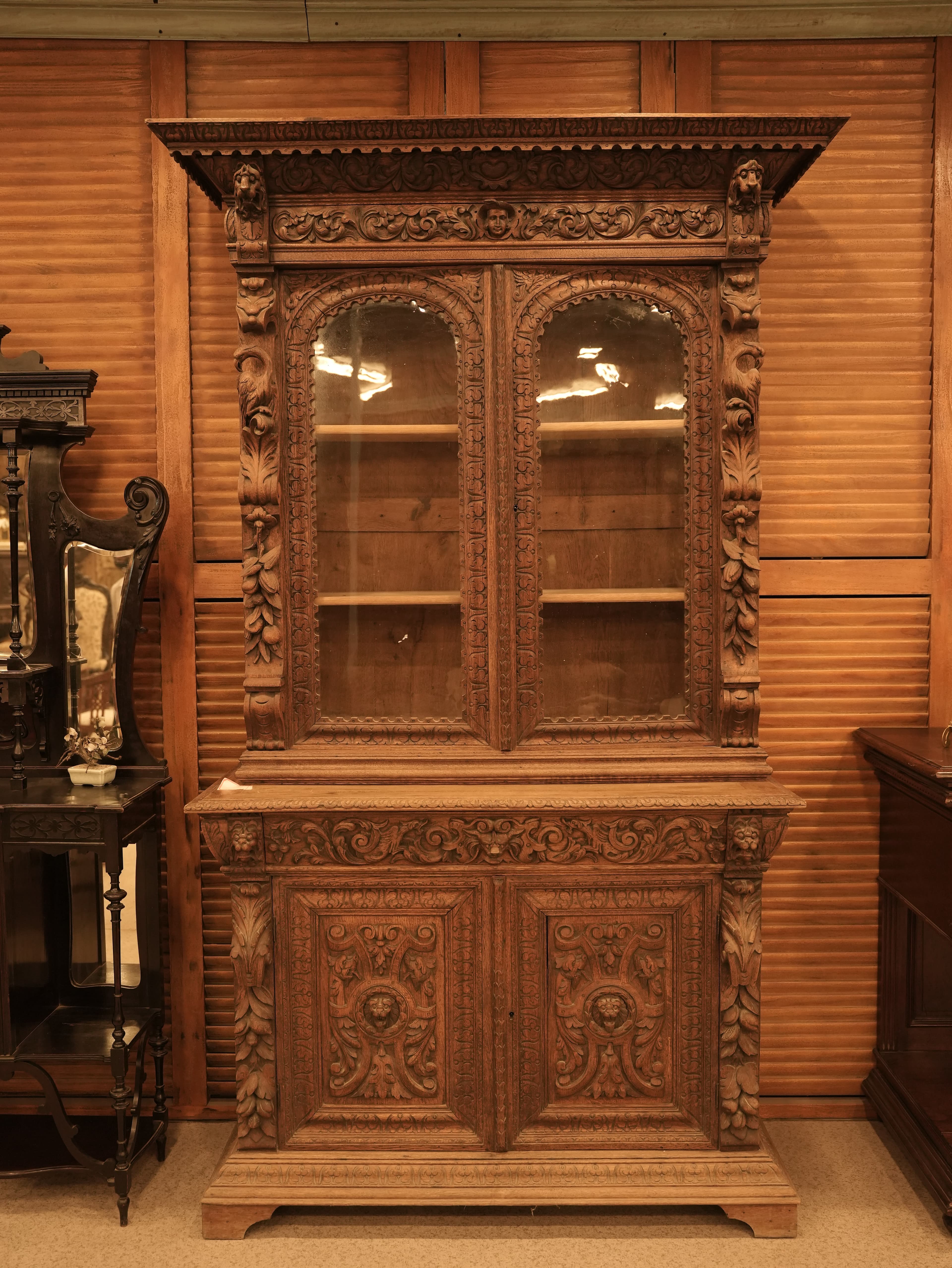 This is a French Renaissance Revival carved oak buffet d deux corps from the 19th century.