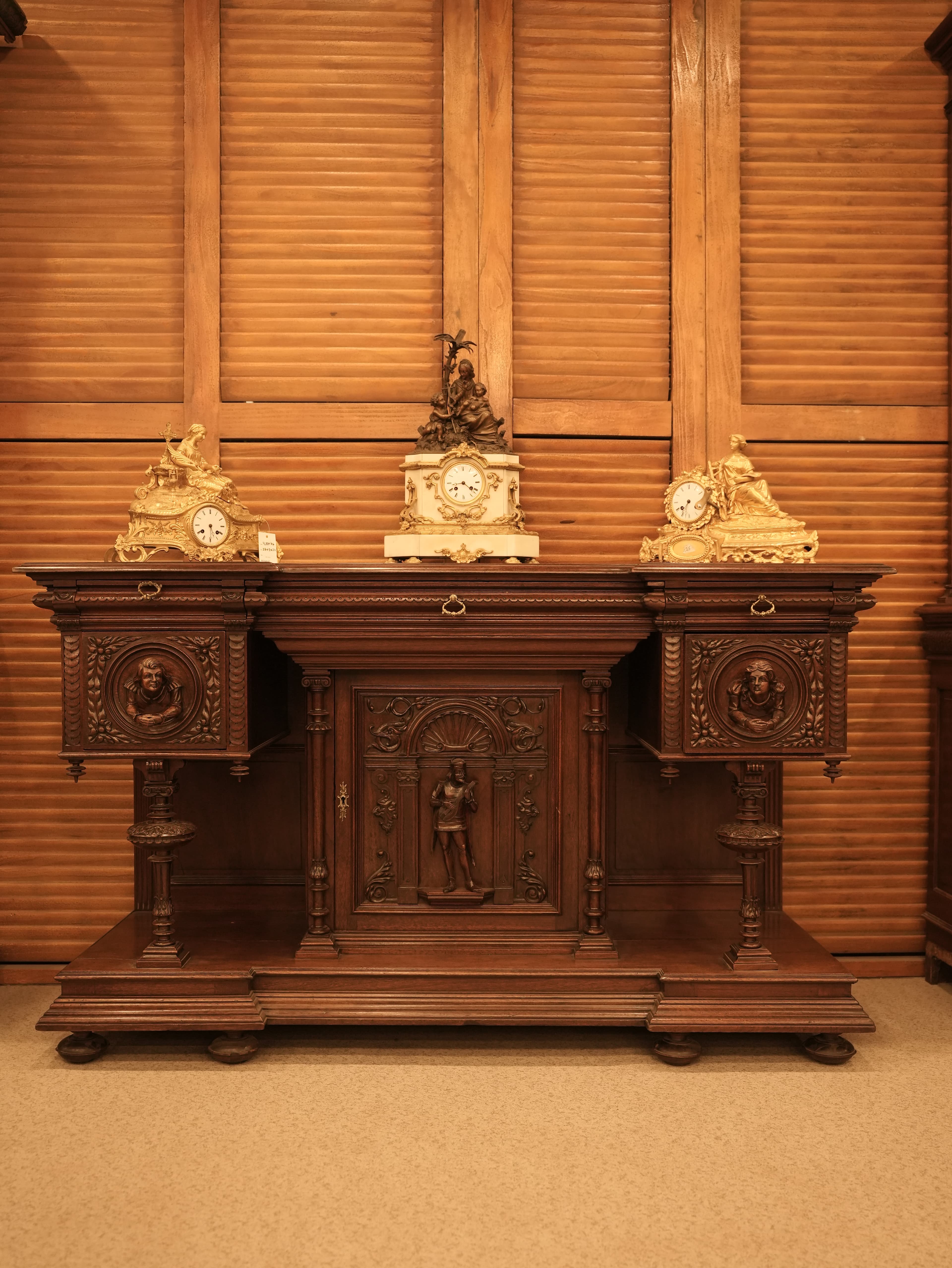 Antique French Renaissance Revival sideboard or buffet a deux corps, likely crafted from richly carved walnut in the late 19th century.